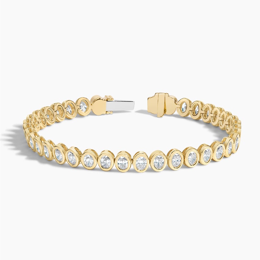 Elegant Oval Gold Tennis Bracelet with Emerald-Cut Stones