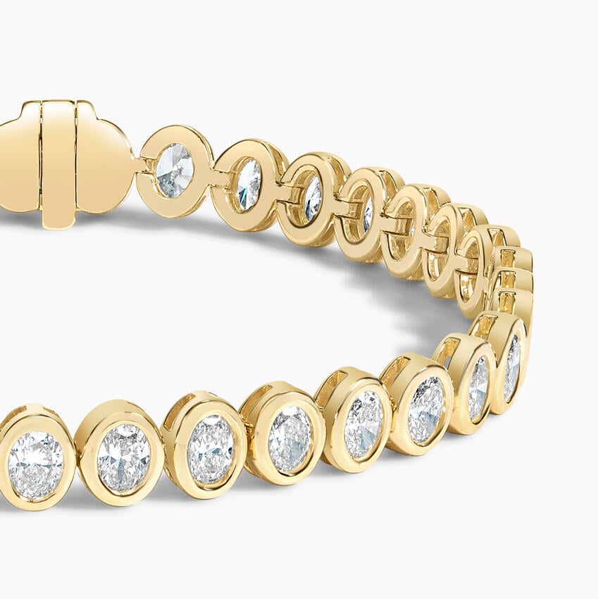 Elegant Oval Gold Tennis Bracelet with Emerald-Cut Stones